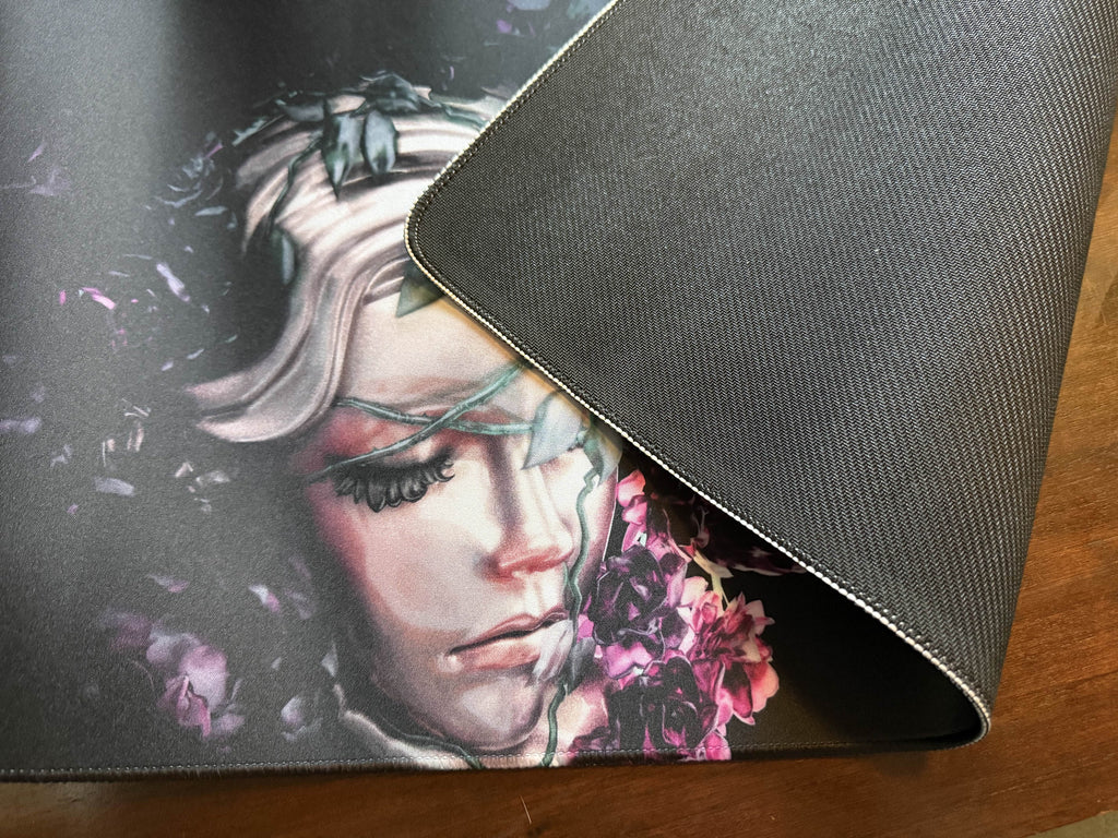 Bad Vibes home decor art mat showing a painted portrait of a woman with purple flowers and non slip black backing