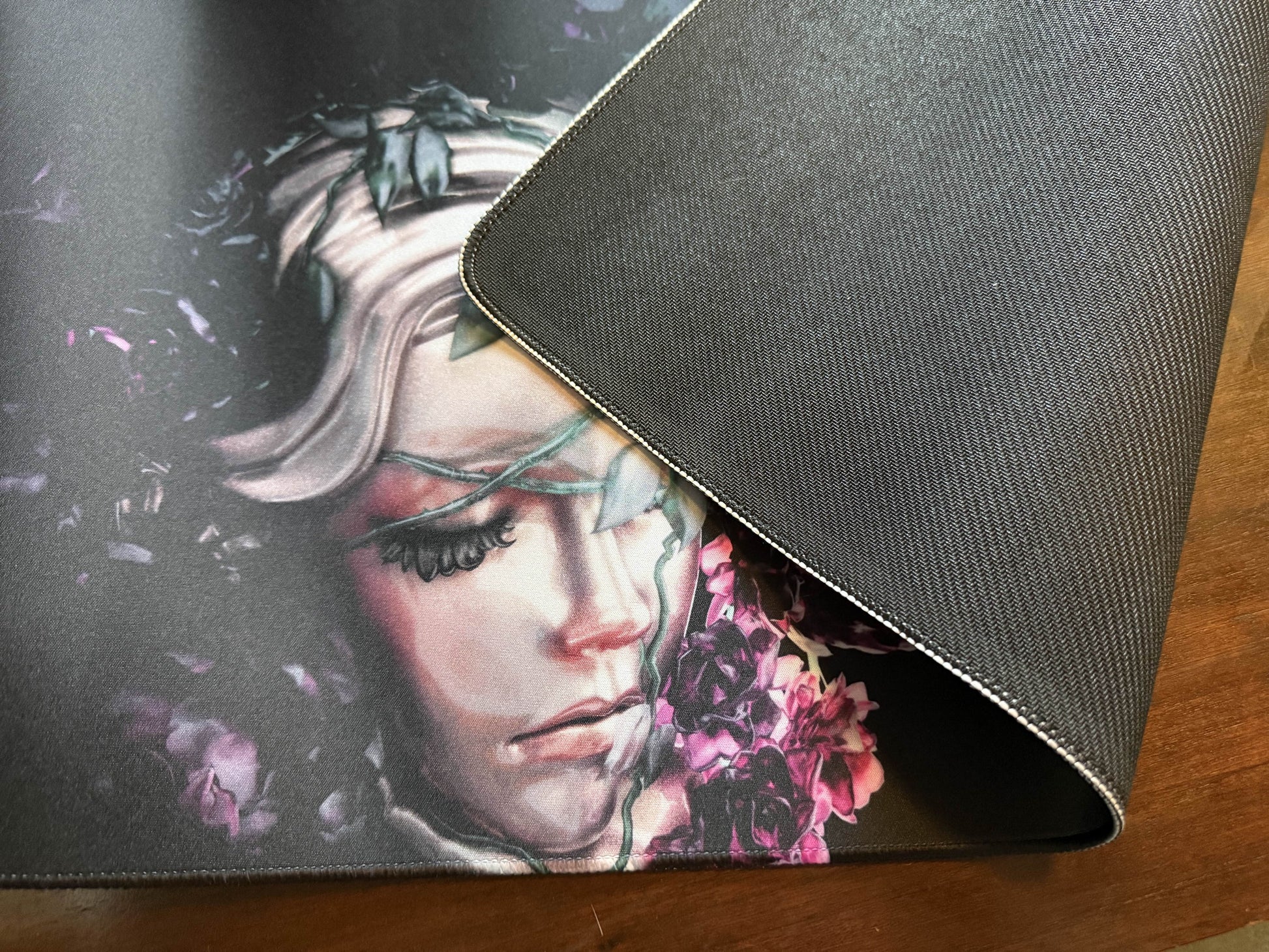Bad Vibes home decor art mat showing a painted portrait of a woman with purple flowers and non slip black backing